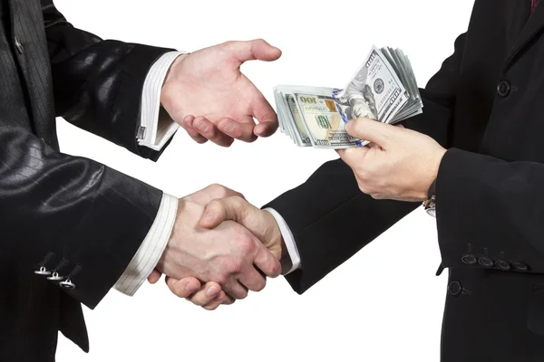 Handshake with the transfer of money — Stock Photo, Image