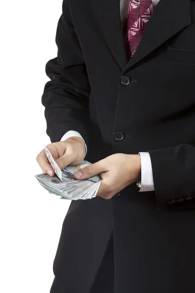 Businessman counts money in hands — Stock Photo, Image