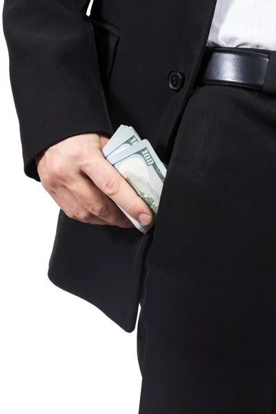 Male hand puts money into his trouser pocket — Stock Photo, Image