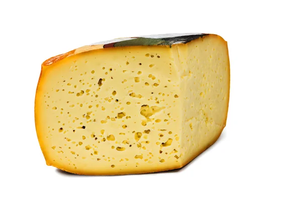 Stück Käse mit kleinen Löchern — Stockfoto