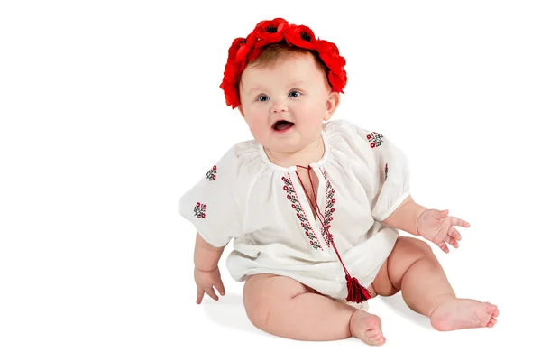 Cute baby with wreath of poppies sitting — Stock Photo, Image