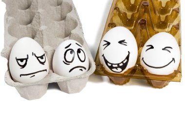 Two sad and cheerful couple eggs clipart