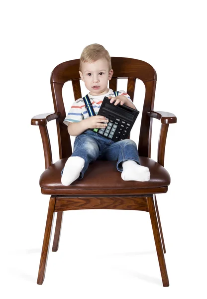 Niño divertido con una calculadora —  Fotos de Stock