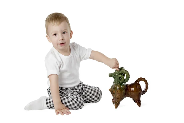 Little boy plays toy sheep — Stock Photo, Image