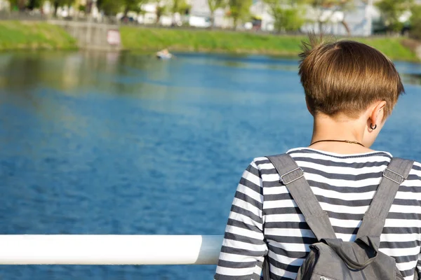 Girl looking at the river — Stock Photo, Image