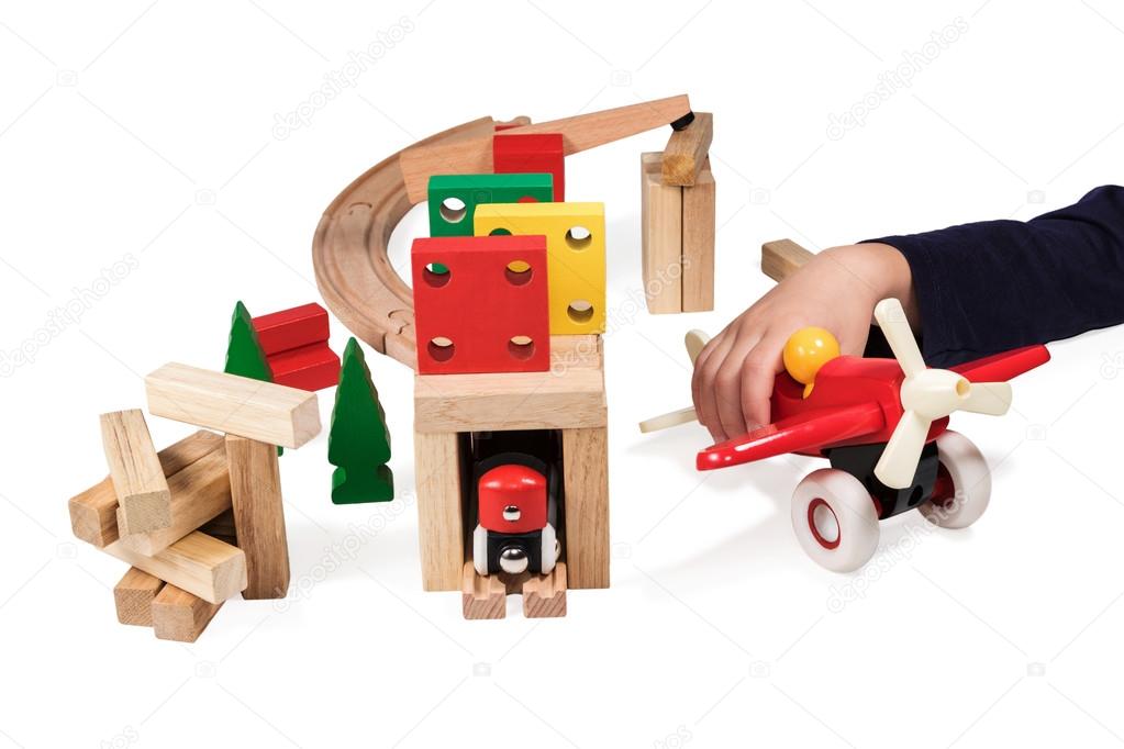 Child playing wooden toys