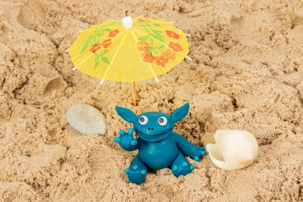 Plasticine monster on the sand — Stock Photo, Image