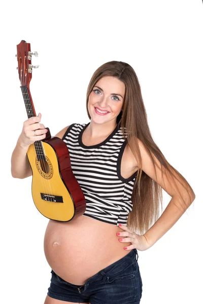 怀孕的妈妈，与夏威夷四弦琴 — 图库照片
