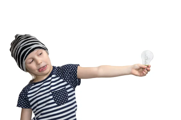 Child looks with disgust at the incandescent — Stock Photo, Image