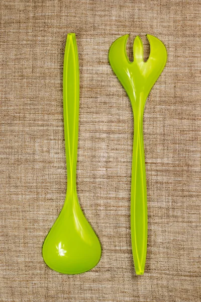 Plastic green serving spoon and fork — Stock Photo, Image