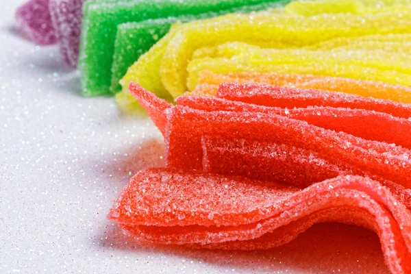 Colorful sugar jelly candy strip over white background — Stock Photo, Image