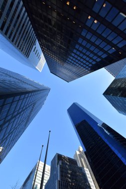 Worm's-eye view architecture and blue background , Lower Manhattan, New York City, USA