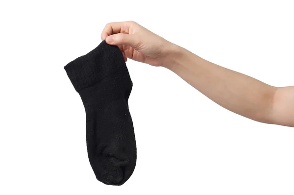 Mano sosteniendo el calcetín negro . — Foto de Stock