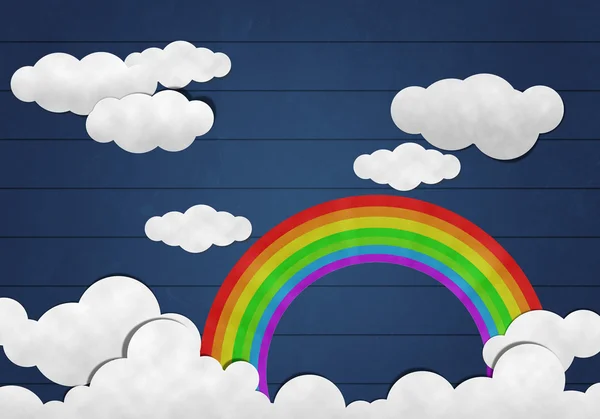 Taglio della carta, arcobaleno e nuvola su sfondo di legno — Foto Stock