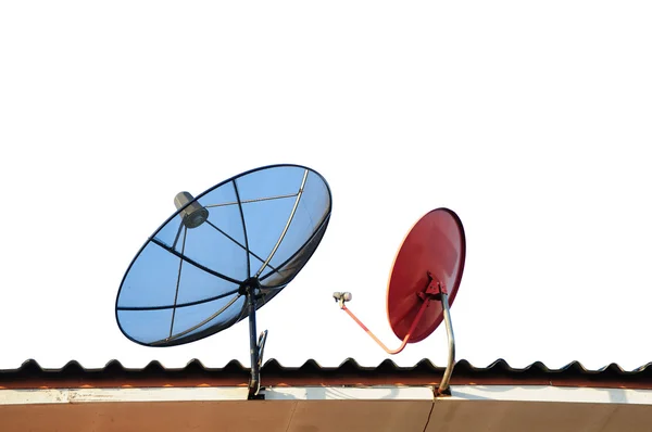 Satellite dishes on a house roof — Stock Photo, Image