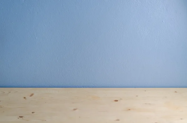 Office desk floor and blue cement background. — Stock Photo, Image