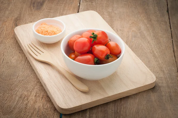 Small tomato on wooden floors. Vegetarian Food. — Stock Photo, Image
