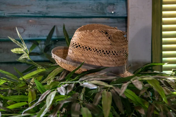 old straw hat on the railing near the fisherman\'s house