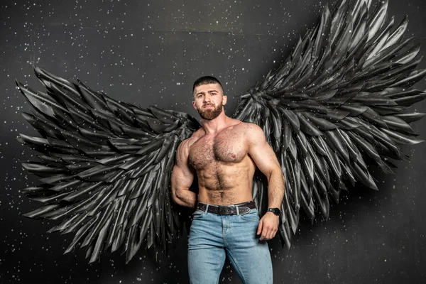 Beautiful Girl Angel Costume Black Wings Handsome Muscular Man Struggling — Stock Photo, Image