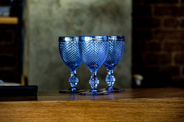 cozy still life with faceted antique glasses on the table