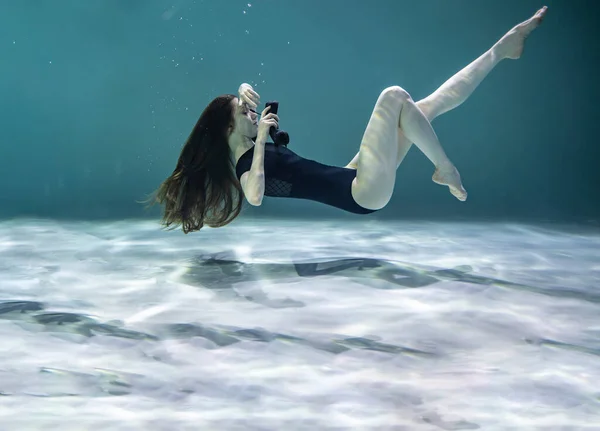 Beautiful Girl Black Swimsuit Posing Underwater Black Telephone Receiver Blue — Stock Photo, Image
