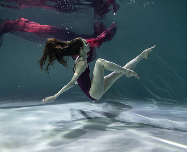 Beautiful Girl Red Swimsuit Red Pareo Underwater Blue Background — Stock Photo, Image