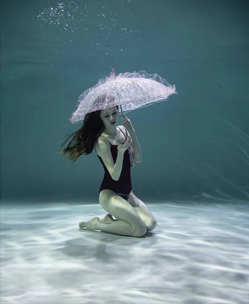 Beautiful Girl Red Swimsuit Pink Umbrella Underwater Blue Background — Stock Photo, Image