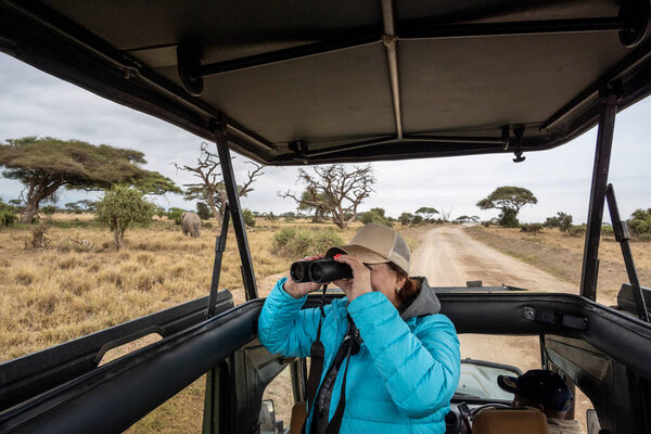 woman tourist posing during safari in africa