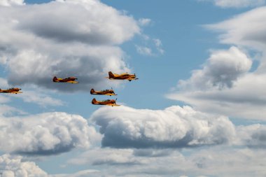 beautiful plane makes a difficult turn leaves a white trail of flight against the background of the sky