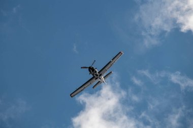 combat aircraft makes difficult turns in the air against the background of the sky 