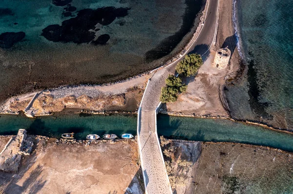 panoramic view of the old stone mills, bridge, road and sea filmed from a drone