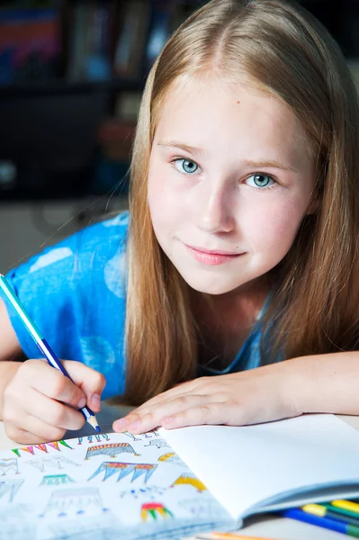 Portrait pretty girl sitting table with adult coloring book pencils . — Stock Photo, Image