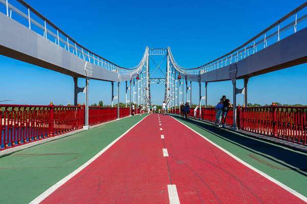 KYIV, UKRAINE - AUGUST 30,2020: Pedestrian bridge over Dnypro river in Kyiv, Ukraine on August 30, 2020. 