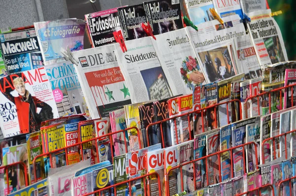A newspaper stand with various print media in Vienna, Austria, Europe