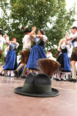 Public performance of a traditional Austrian folk dance at the farmers' market in Mondsee, Austri clipart