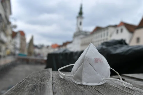 Corona crisis - lockdown - FFP2 mask lies on a table in a street in Steyr, Austria, Europe