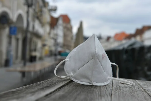 Corona crisis - lockdown - FFP2 mask lies on a table in a street in Steyr, Austria, Europe
