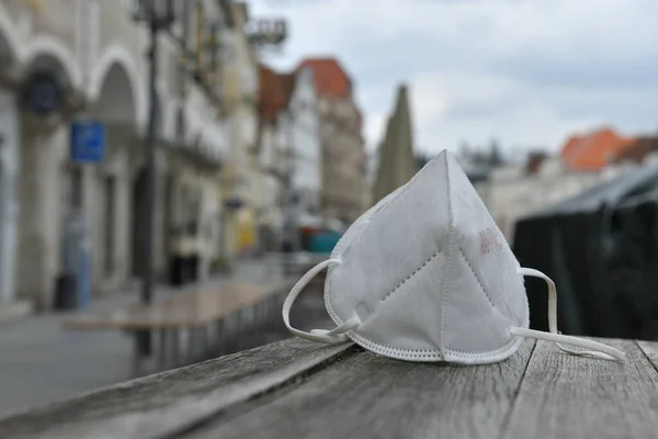 Corona crisis - lockdown - FFP2 mask lies on a table in a street in Steyr, Austria, Europe