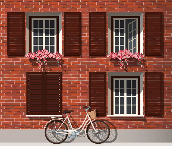 Bakstenen huis en fiets — Stockvector