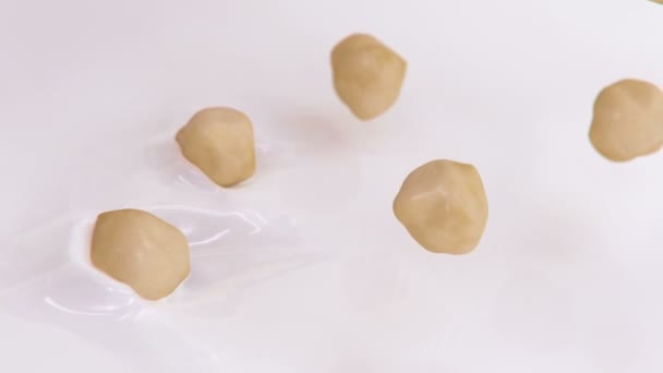 Hazelnuts Splashing Liquid Cream Super Slow Motion — Stock Video