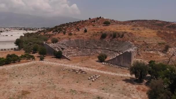 The ancient city of Letoon with an amphitheater and a ruined temple of the goddess Leto — Stockvideo