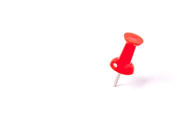 Close up of a red pushpin on white background — Stock Photo, Image