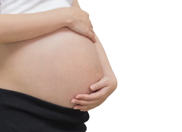 Barriga de uma mulher grávida, isolada contra fundo branco — Fotografia de Stock