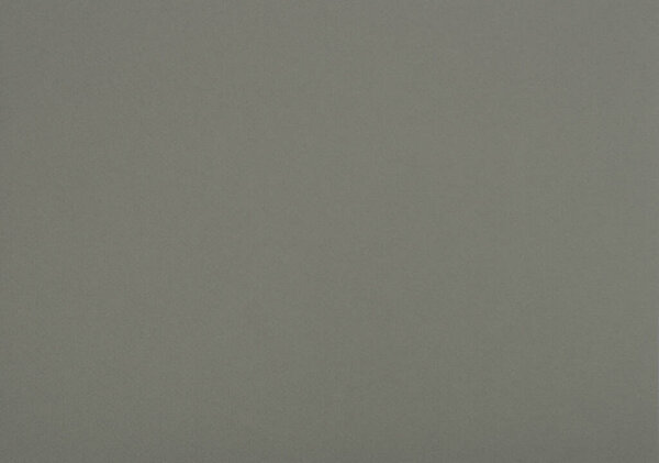 Medium grey paper background. Greenish grey colour paper texture.
