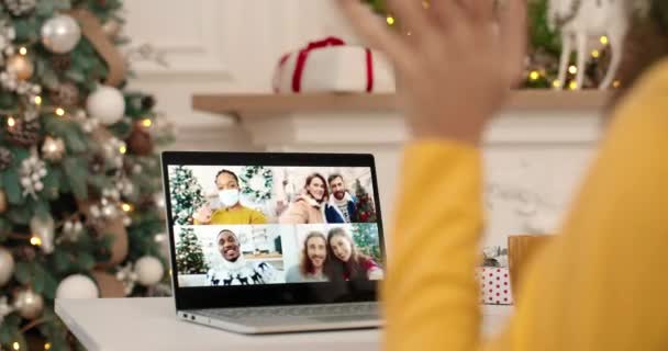 Close up. Collage of multiple video call on laptop screen. Mixed-races friends speaking on internet web chat on New Years Eve in good mood. Woman talking with Caucasian and African American friends — Stock Video