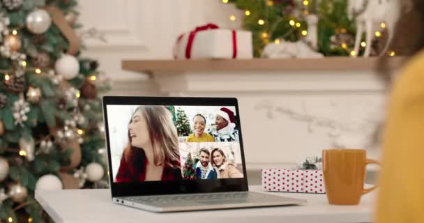 Close up. Female talking on multiple video call on laptop with mixed-races African American and Caucasian friends on New Years Eve in good mood. Woman speaking with different people on computer — Stock Video