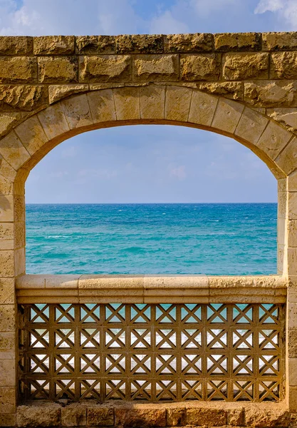 Stone arches on the background of the sea