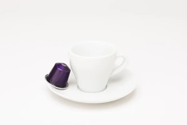 Coffee cup with capsule — Stock Photo, Image