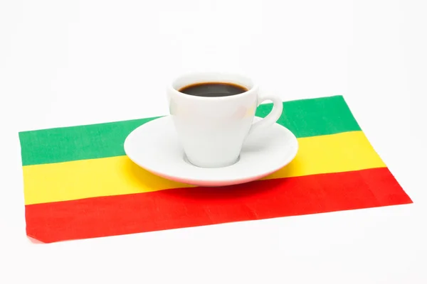 Kopje koffie met vlag — Stockfoto