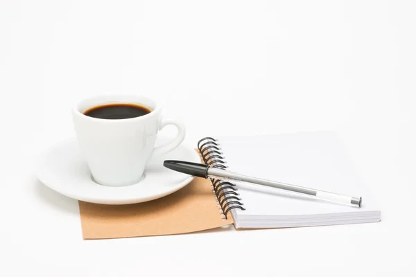 Cup of coffee with notebook — Stok fotoğraf